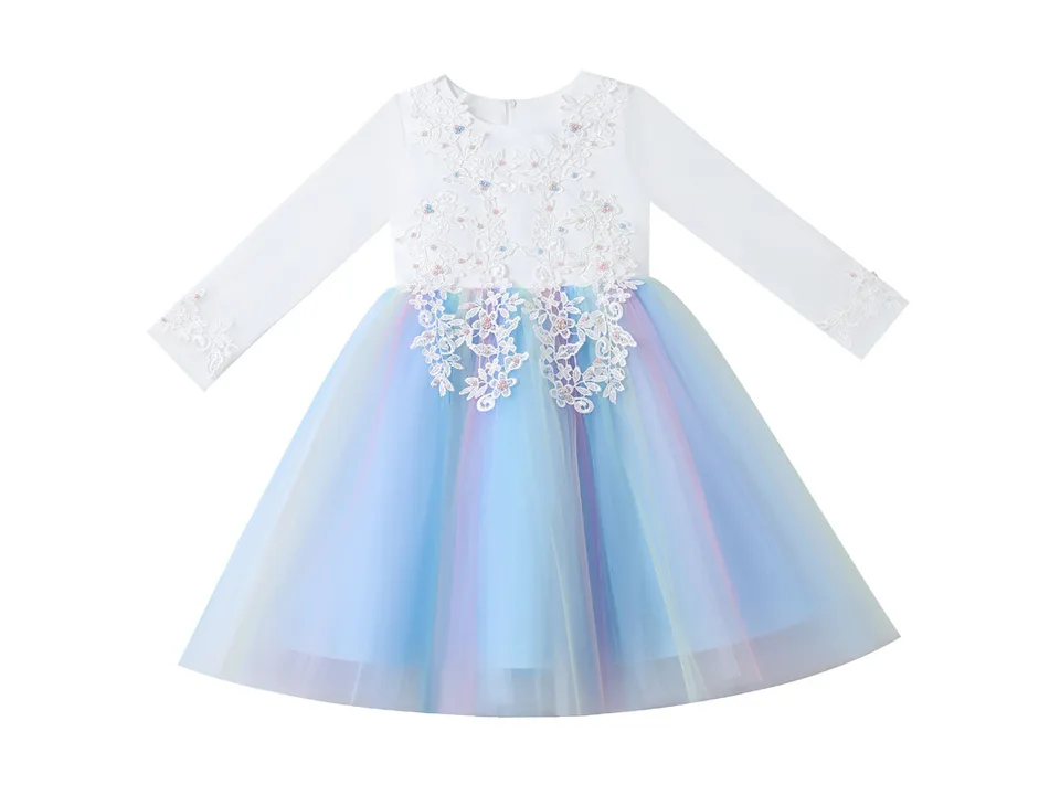 A white long-sleeved dress with a rainbow gradient mesh skirt and floral lace bodice on a plain background.