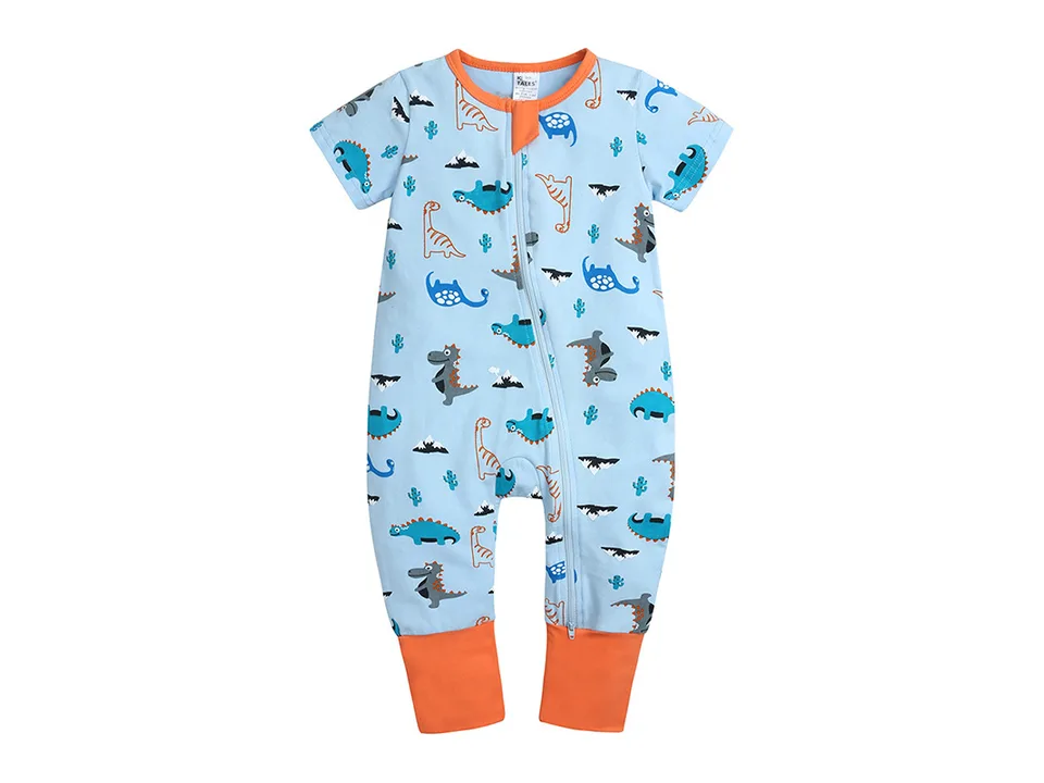 Full view of a light blue baby jumpsuit with a dinosaur pattern and orange cuffs.