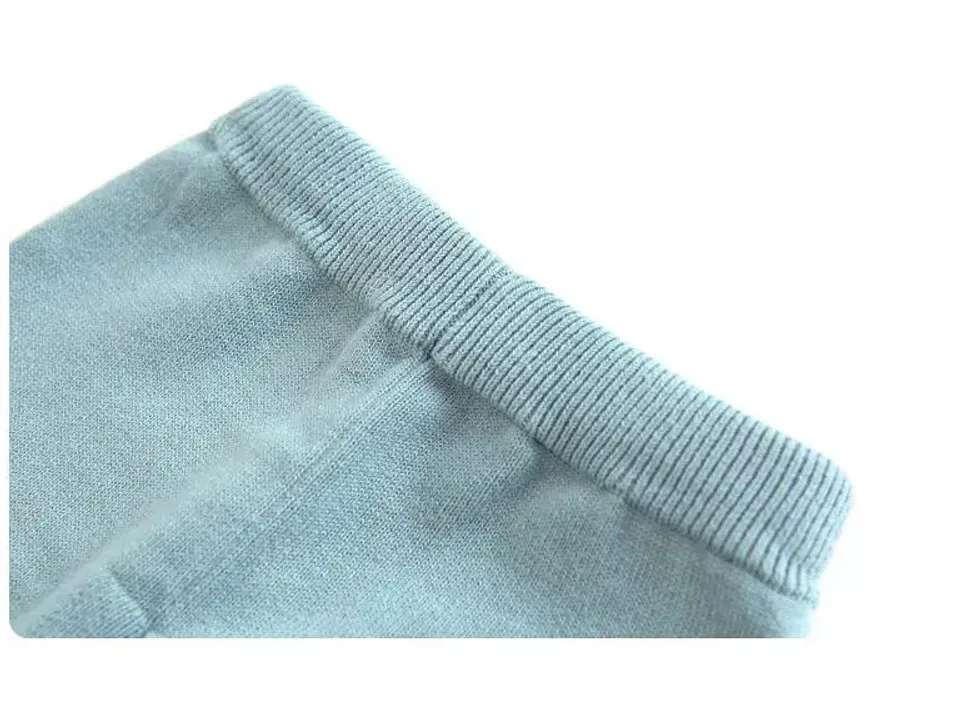 Close-up of the ribbed cuff on the knitted pants.