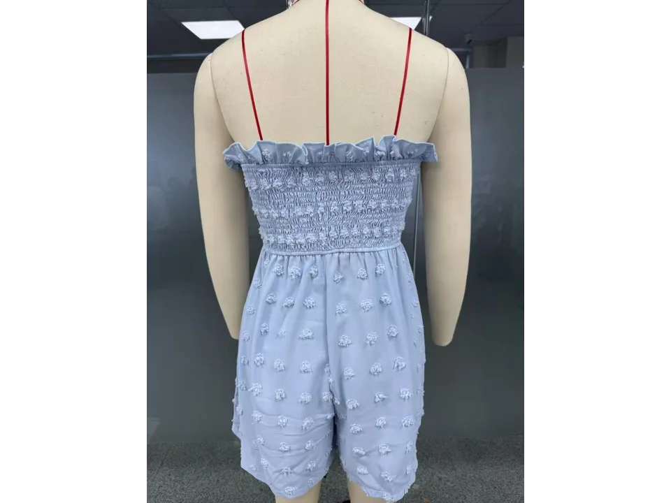 Back view of the light blue jumpsuit on a mannequin.