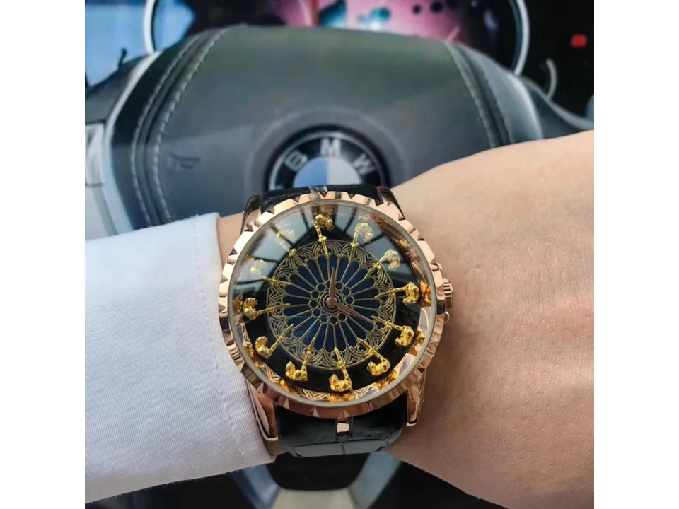 A men's watch with a knight-themed dial worn on a wrist.