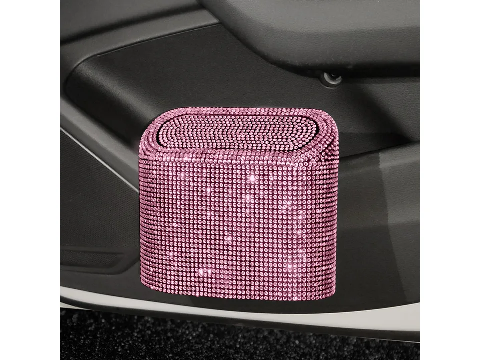 Pink rhinestone studded car trash can mounted in a vehicle interior.