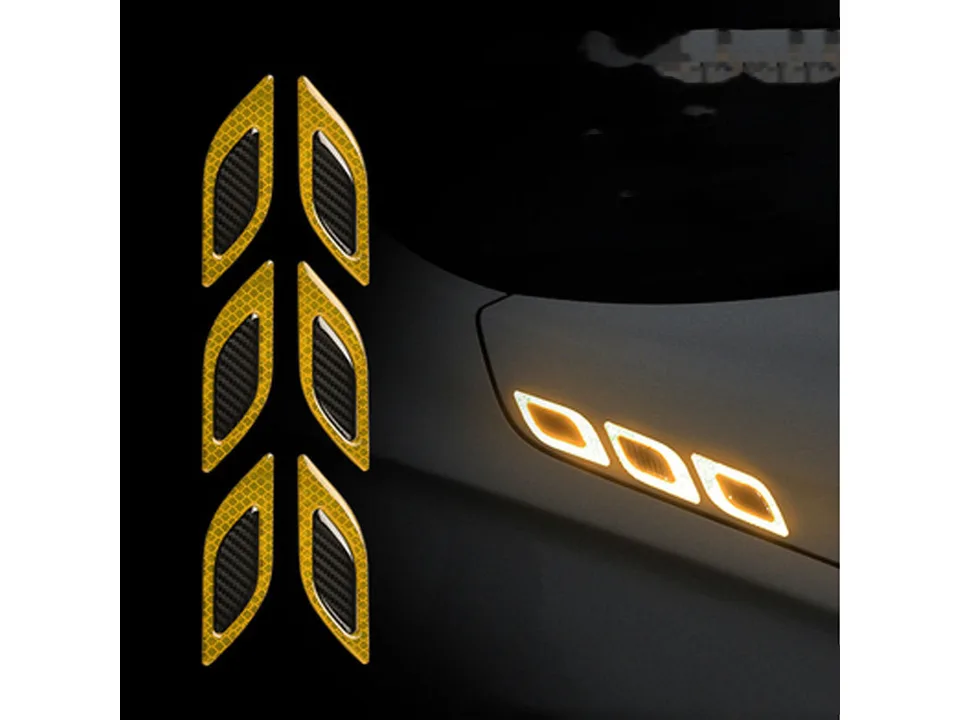 Yellow reflective car air vent stickers applied to a vehicle body.