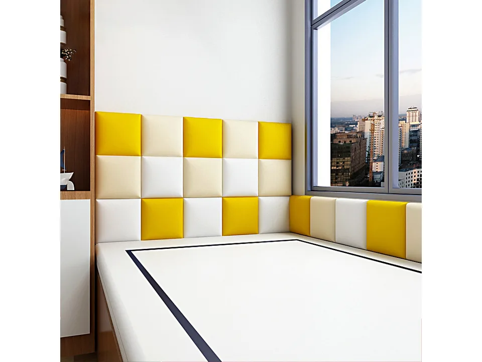Red, white, and blue padded wall panels installed along a hallway wall.