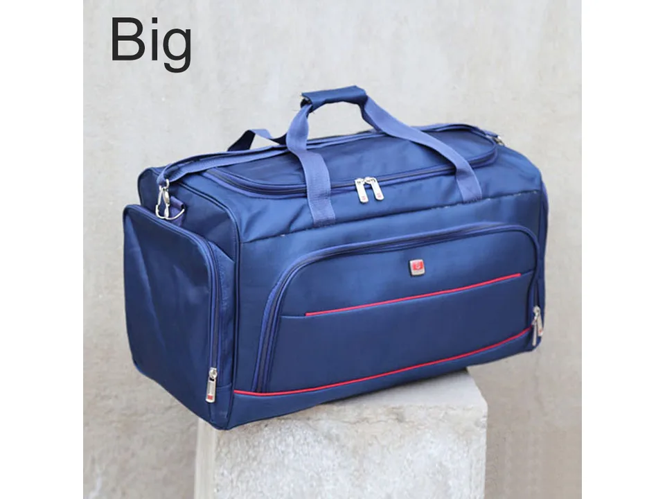 Blue travel duffel bag with red accents on a concrete block.