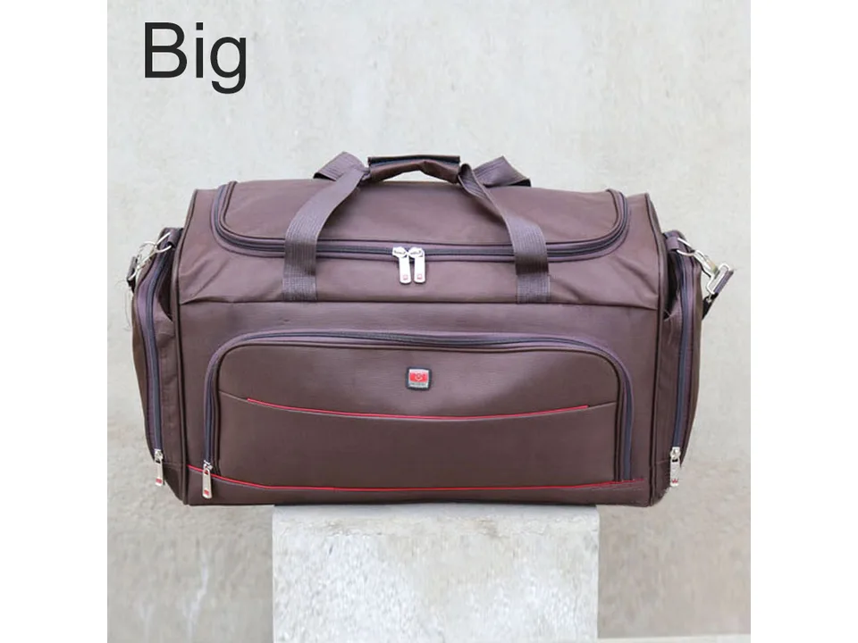 Brown travel duffel bag with red accents on a concrete block.