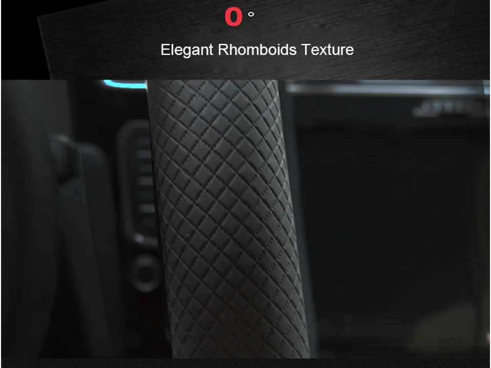 Close-up view of the black leather steering wheel cover showing the rhomboid texture.