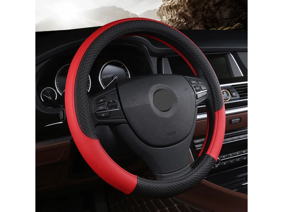 Red and black leather steering wheel cover installed on a car steering wheel.