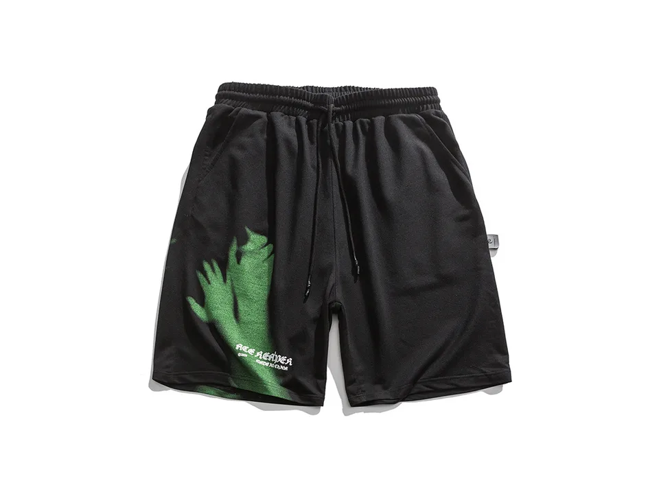 Black shorts with a green hand graphic and drawstring waist, laid flat.