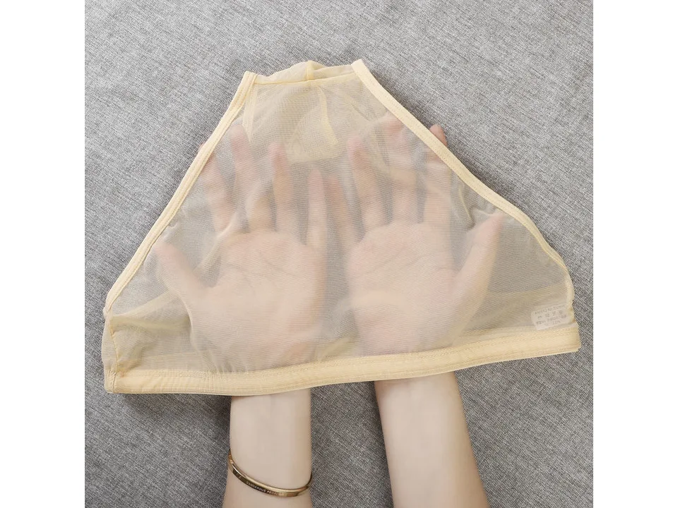 Close-up of sheer mesh fabric held by hands