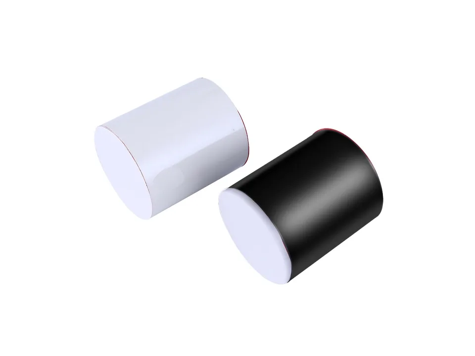 A roll of white adhesive tape and a roll of black adhesive tape.