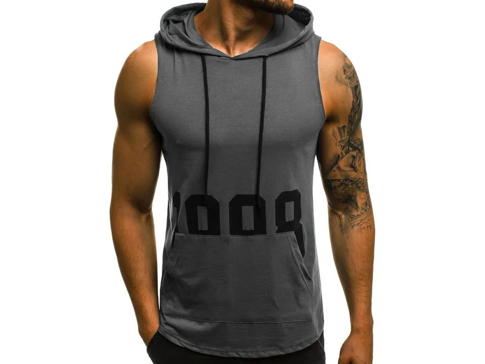 A man wearing a grey sleeveless hooded tank top with a black graphic print.