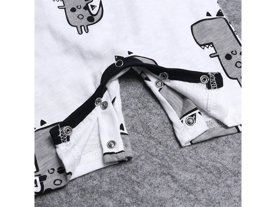 Close-up of the metal snap buttons at the crotch of the baby romper.