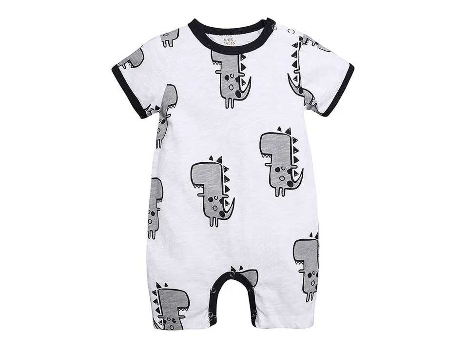 Front view of a white baby romper with a grey dinosaur print and black trim.