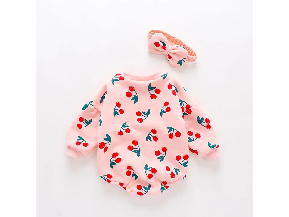 Pink baby jumpsuit with cherry print and matching headband