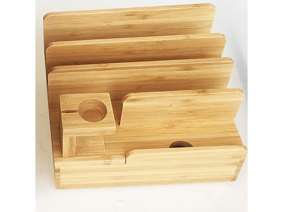 Close-up view of the bamboo charging station slots and watch stand.