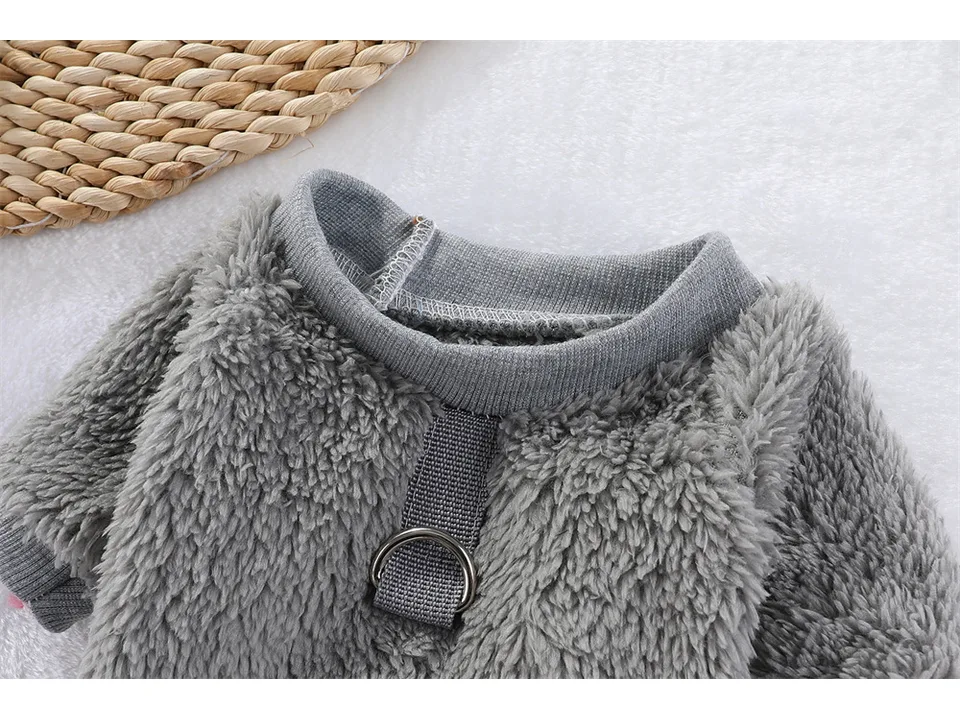 Close-up of the grey fleece dog sweater collar and D-ring leash attachment.