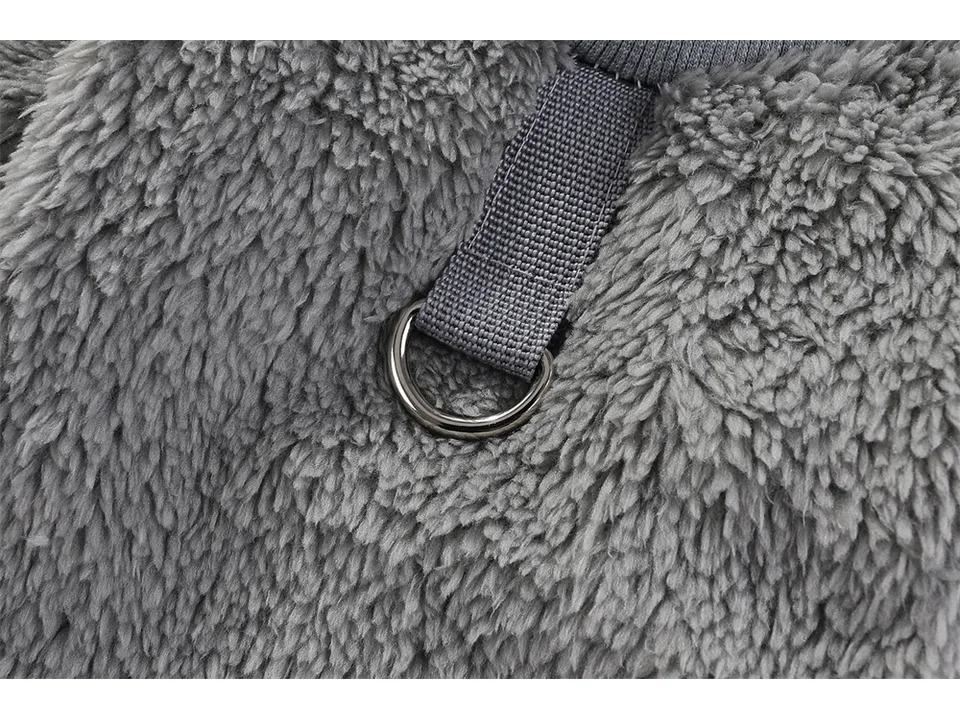 Close-up of the metal D-ring on the fleece sweater.