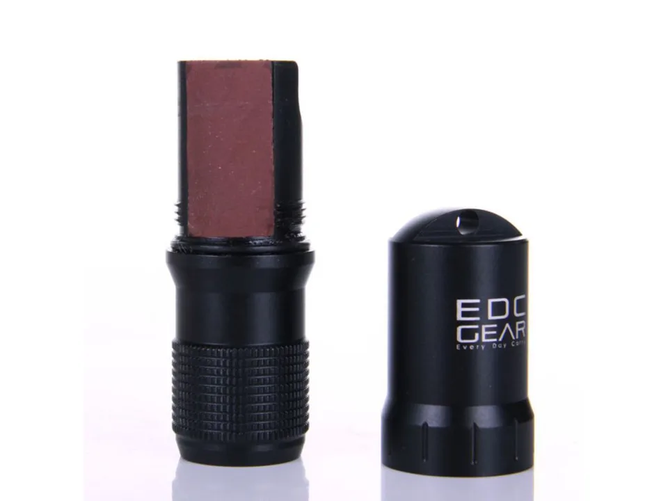 A black survival capsule opened to reveal a brown internal component.