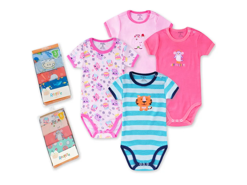 A collection of various baby bodysuits with different patterns and colors.
