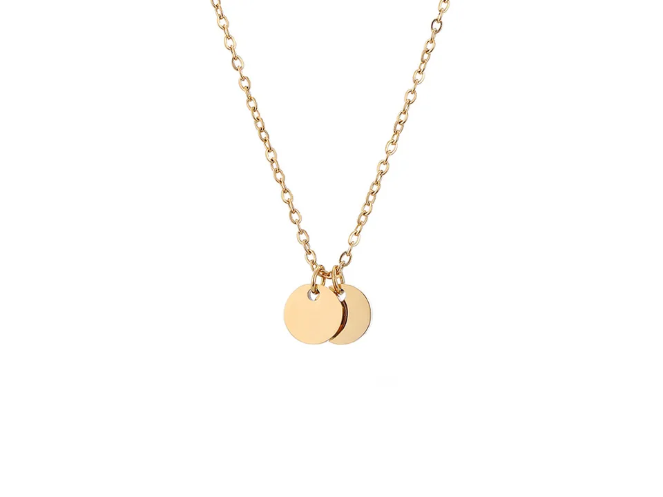 A gold necklace with two small round pendants.