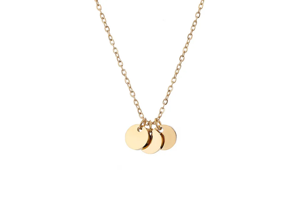 A gold necklace with three small round pendants.