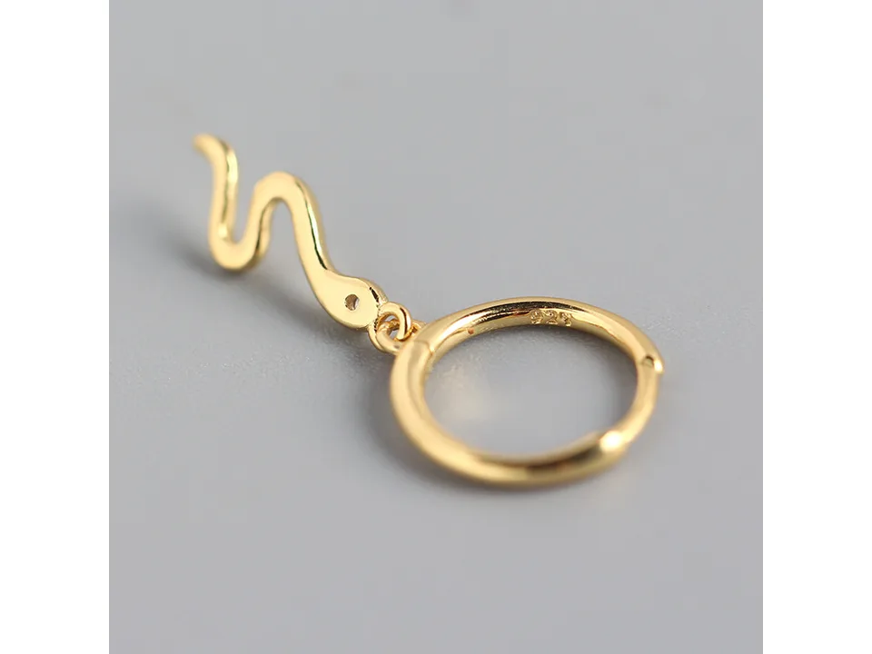 Close-up of a single gold snake hoop earring showing the 925 hallmark.