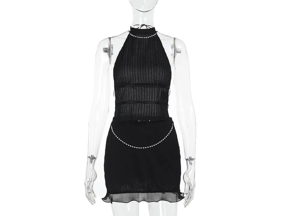Black halter top and mini skirt set with pearl chain detail on a mannequin