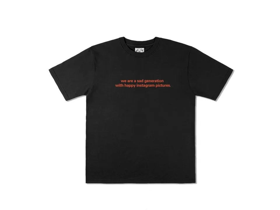 Black t-shirt with the text 'we are a sad generation with happy instagram pictures' in red.