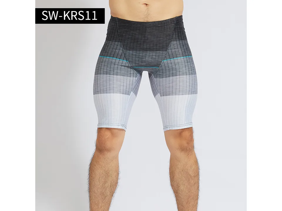 Model wearing grey gradient athletic swimming trunks.