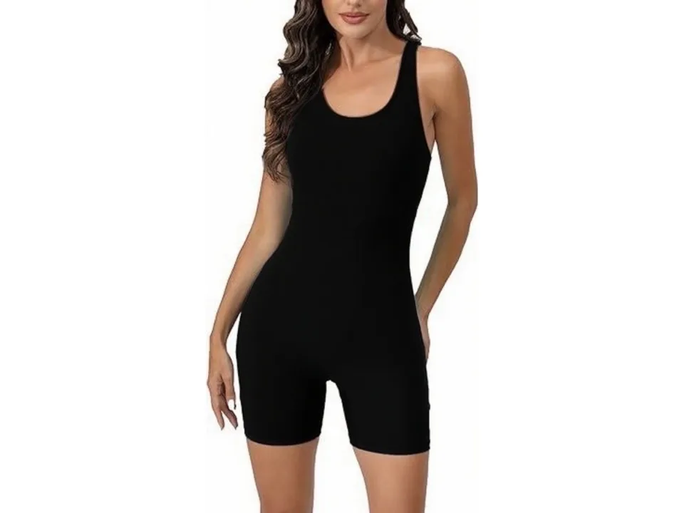 Front view of a woman wearing a solid black one-piece capri swimsuit.