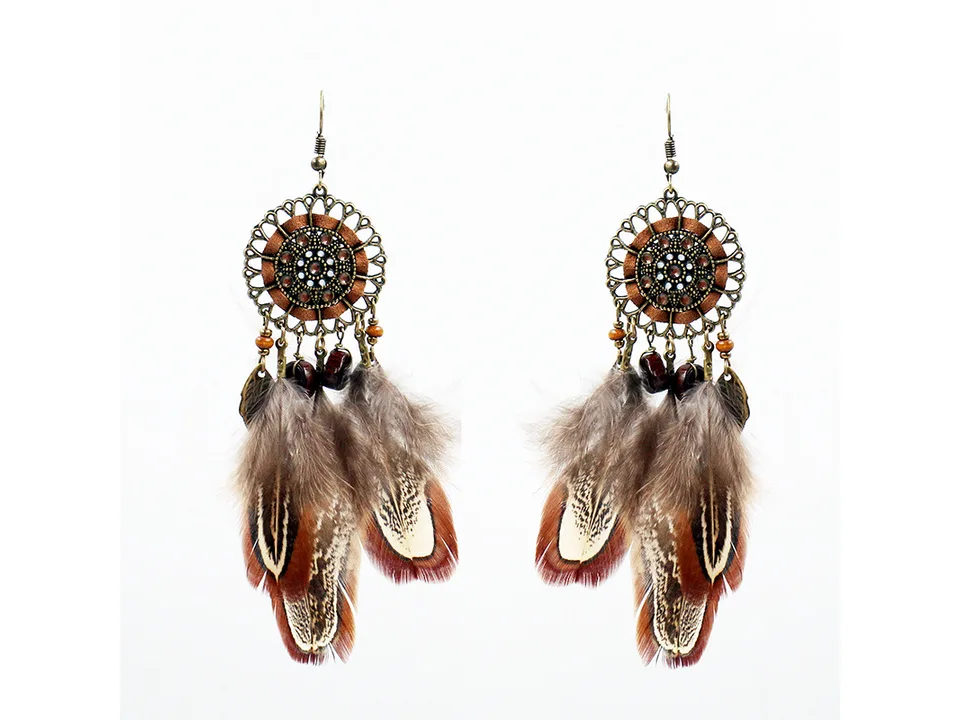A pair of bohemian feather dreamcatcher earrings on a white background.