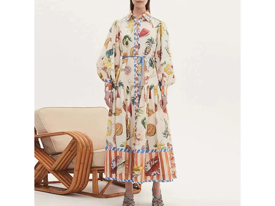 A model wearing the fruit print maxi shirt dress, showing how it fits on a person.