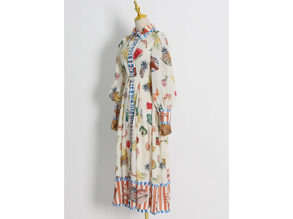 Side view of the fruit print maxi shirt dress on a mannequin.
