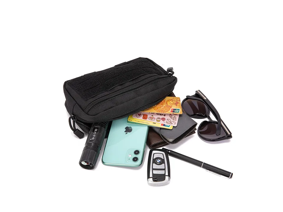 Tactical pouch with various items like a phone, flashlight, keys, and wallet spread out in front.
