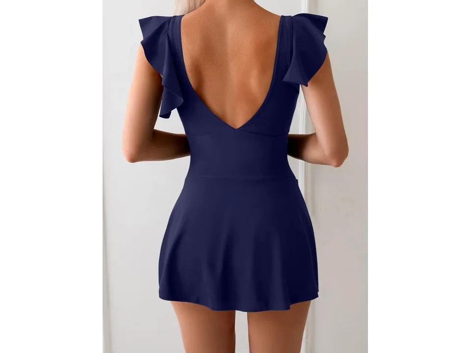 Back view of a solid navy blue one-piece swimsuit with ruffle sleeves and a skirted bottom.