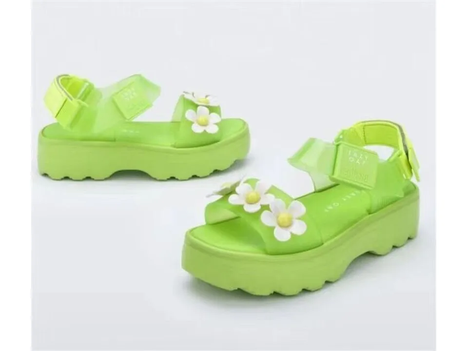 Lime green platform sandals with white flower embellishments on the strap.