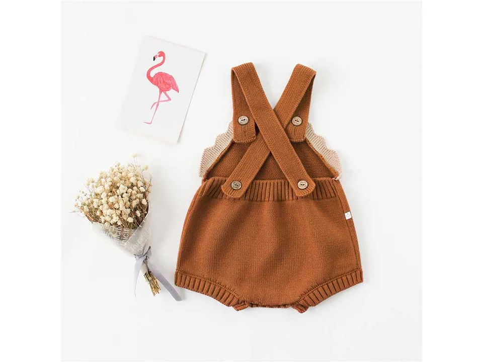 Back view of a brown baby knit romper with crisscross straps.