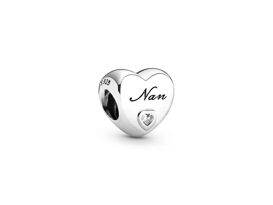 Silver heart-shaped charm bead engraved with 'Nan' and a small clear stone.