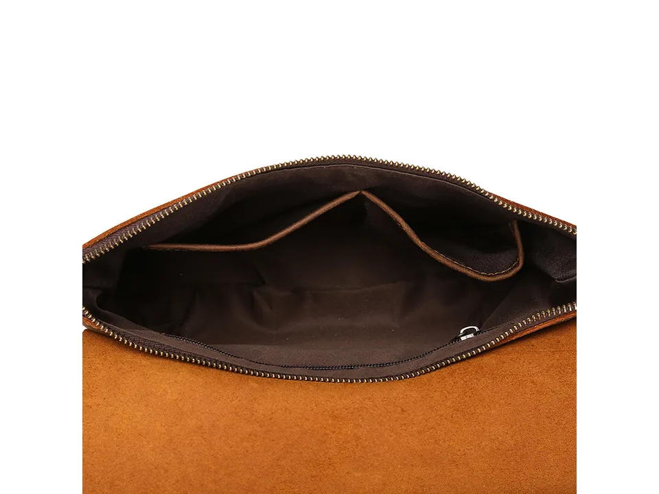 Interior view of the brown leather bag showing pockets and lining