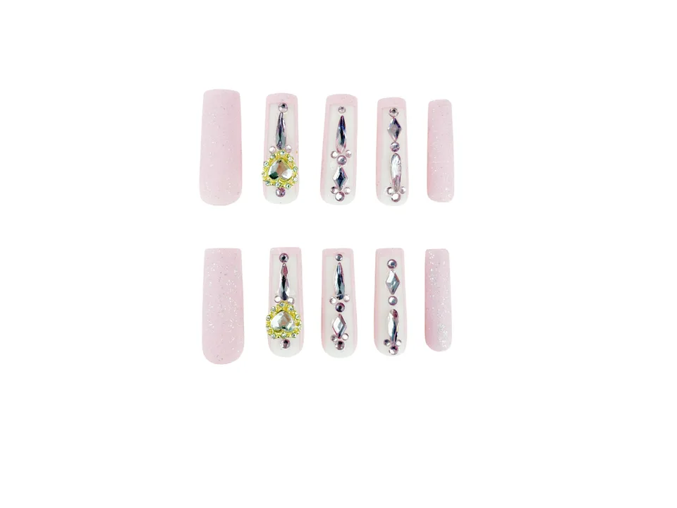 A full set of ten long square press-on nails with pink glitter and rhinestone heart accents.