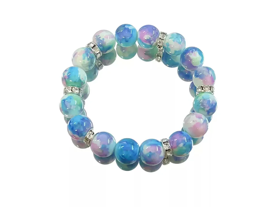 A blue and purple glass bead bracelet with rhinestone spacers on a white background.