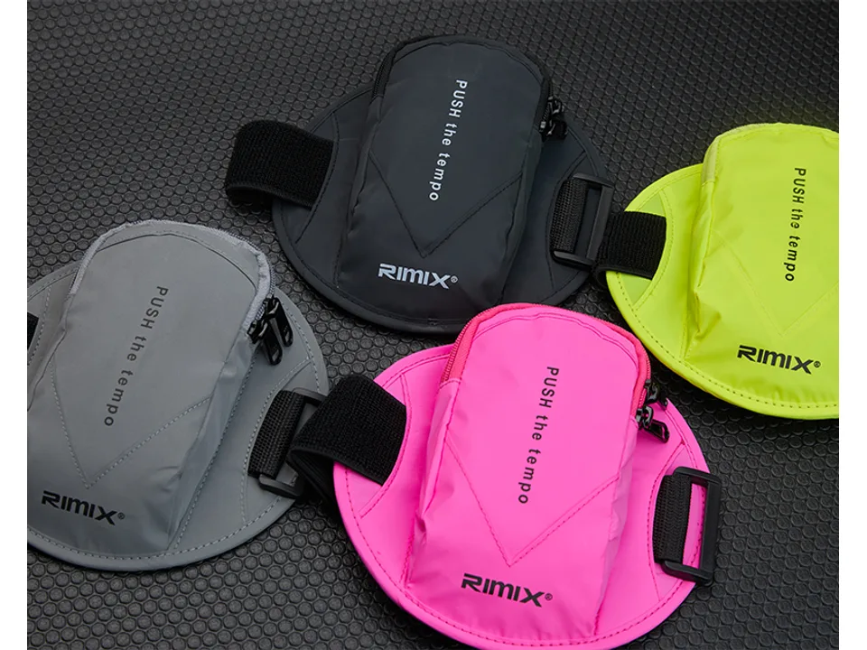 Close-up view of the sports arm bag in black, grey, pink, and neon yellow.