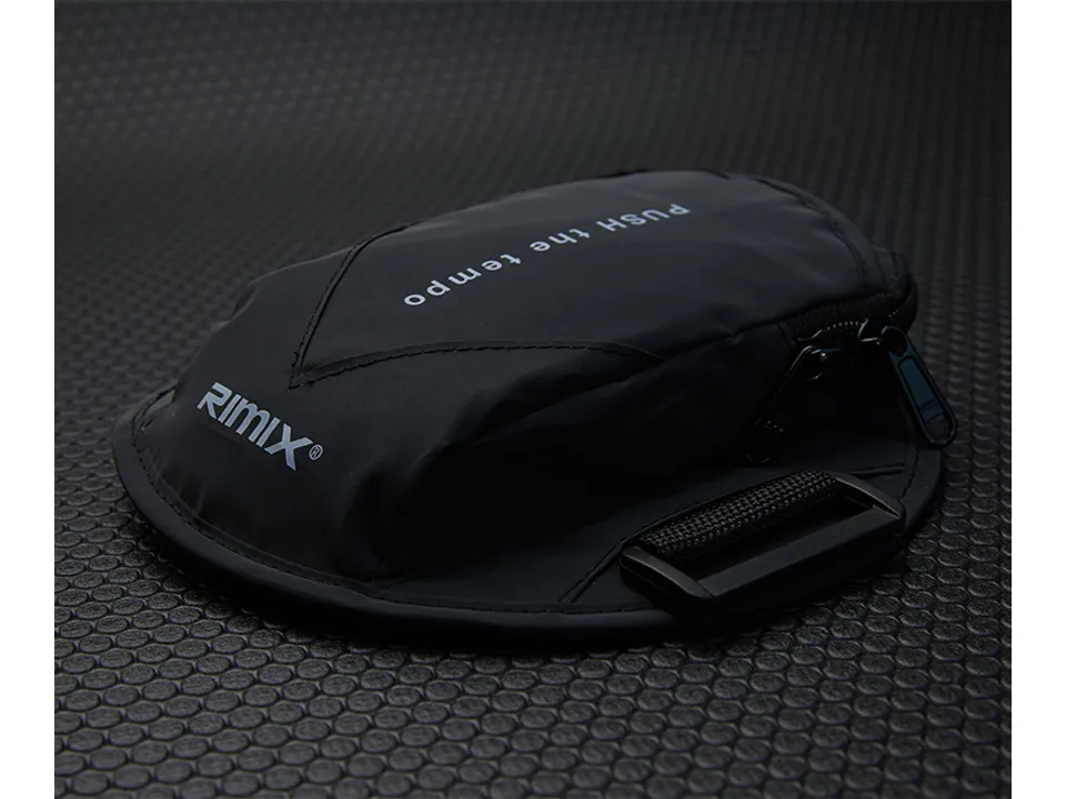 A single black sports arm bag with zipper closure.