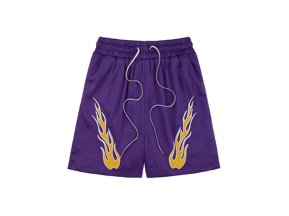 Purple athletic shorts with flame embroidery and white drawstring.