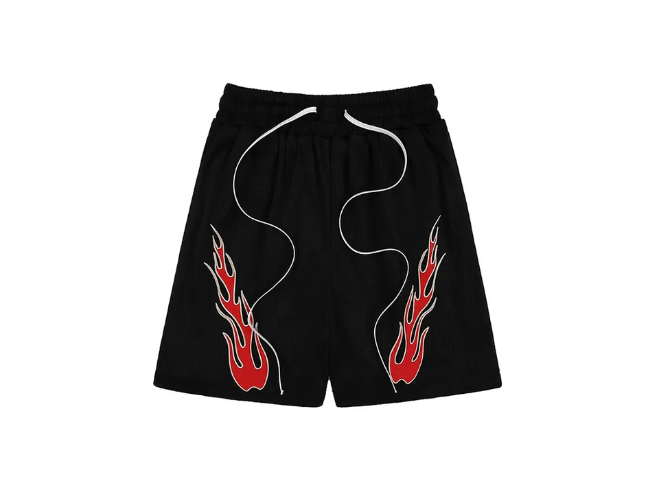 Black athletic shorts with red flame embroidery and white drawstring.