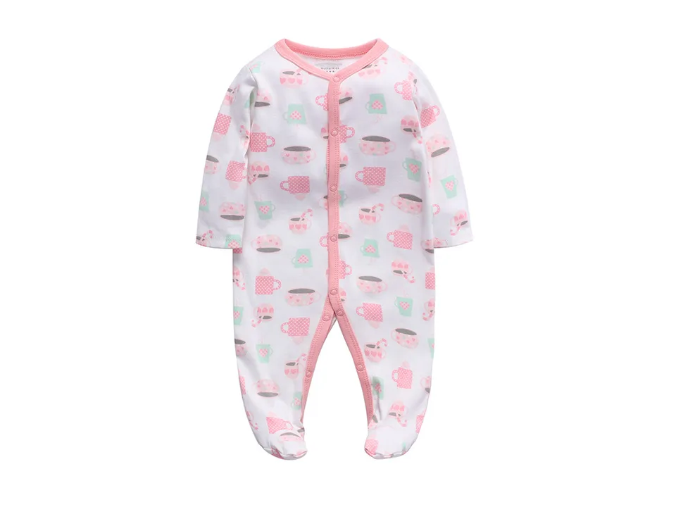 White baby footed jumpsuit with a pink coffee cup pattern.