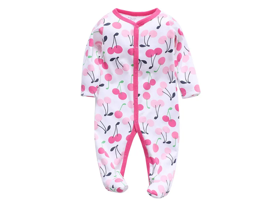 White baby footed jumpsuit with a pink cherry pattern.