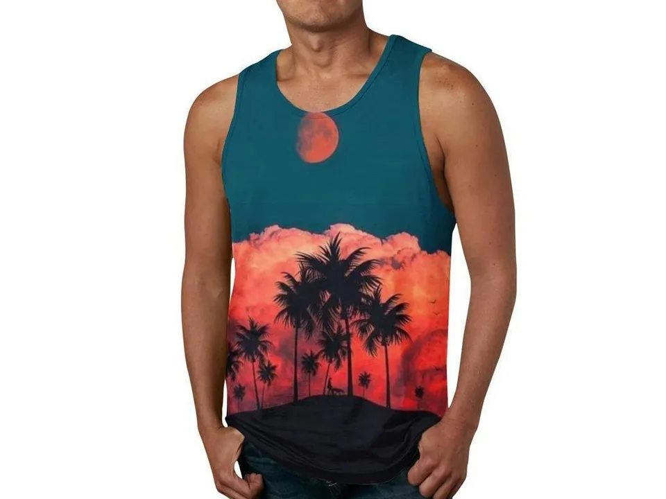 A man wearing a sleeveless tank top with a red sunset, palm trees, and a moon graphic print.