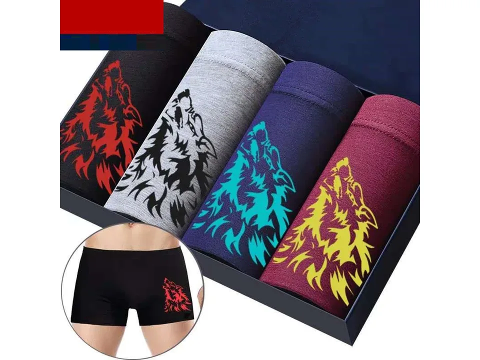 A set of four men's boxer shorts with wolf designs, with an inset showing the fit on a model.